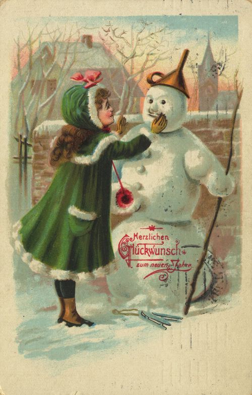 Mädchen schmückt Schneemann